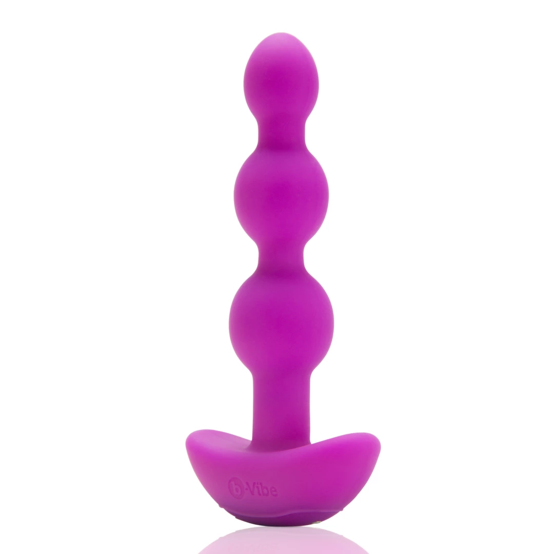 Koraliki analne wibrujące wykonane z silikonu w kolorze fuksji B-Vibe Triplet Fuchsia