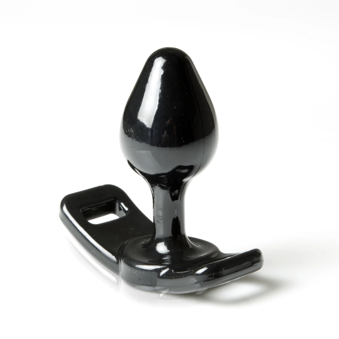 Korek analny wykonany z czarnego silikonu do straponów Perfect Fit Strap On Butt Plug