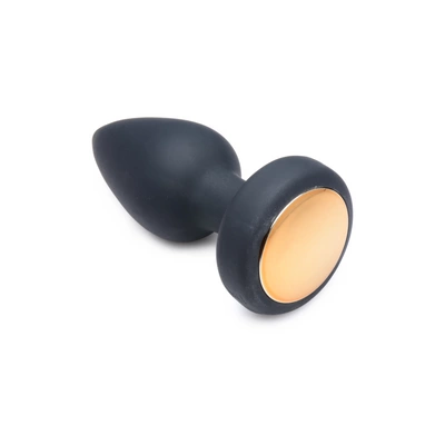 Wibrujący korek analny wykonany z czarnego silikonu z kryształem LED XR Brands 9 cm